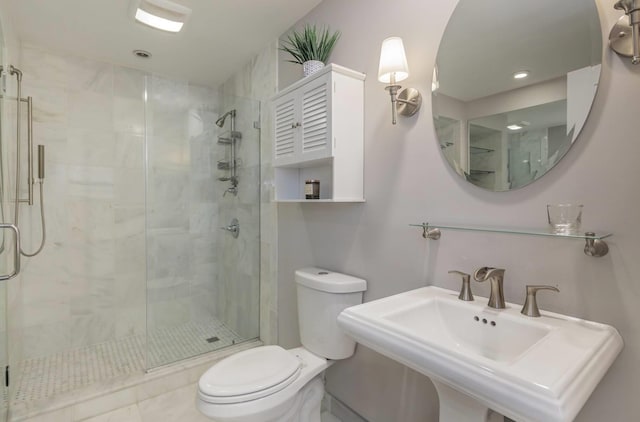 bathroom featuring toilet, an enclosed shower, and sink