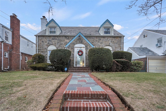 view of front of home with cooling unit and a front yard