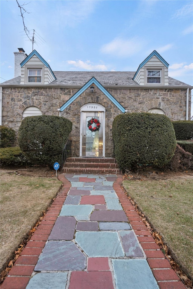 view of property's community with a lawn