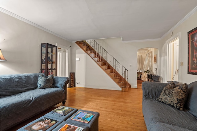 living room with crown molding and hardwood / wood-style floors