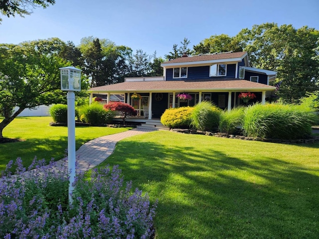 view of front facade with a porch and a front lawn