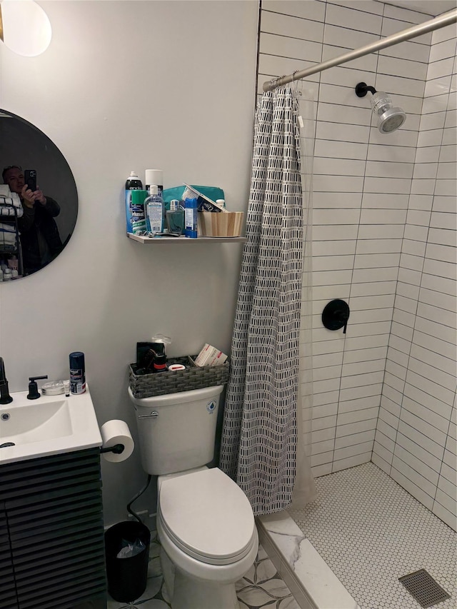 bathroom featuring a shower with curtain, toilet, and vanity