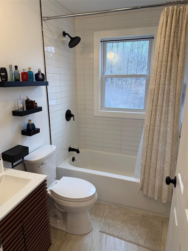 full bathroom featuring shower / tub combo, vanity, and toilet