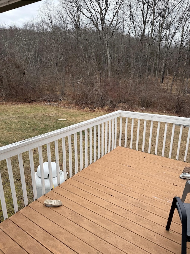 deck featuring a lawn