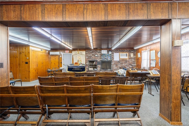 interior space with brick wall, rail lighting, wooden ceiling, and wood walls