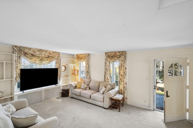 living room with light carpet and plenty of natural light