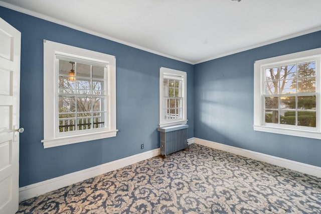 carpeted empty room featuring radiator and ornamental molding