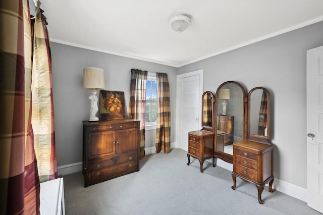 living area with ornamental molding and carpet flooring