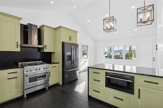 kitchen with vaulted ceiling, appliances with stainless steel finishes, pendant lighting, dark wood-type flooring, and wall chimney range hood