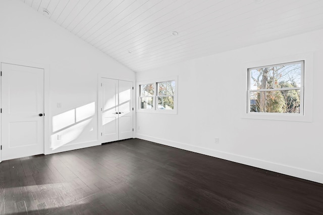 unfurnished room with wood ceiling, vaulted ceiling, and dark hardwood / wood-style floors