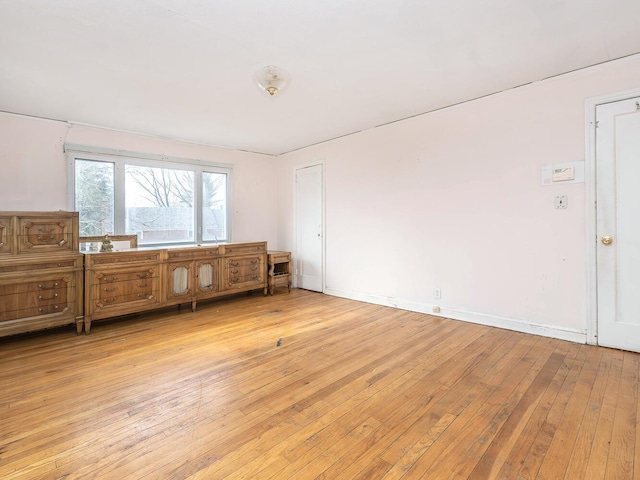 empty room with light hardwood / wood-style floors