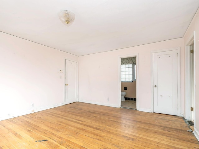 unfurnished room featuring light hardwood / wood-style floors