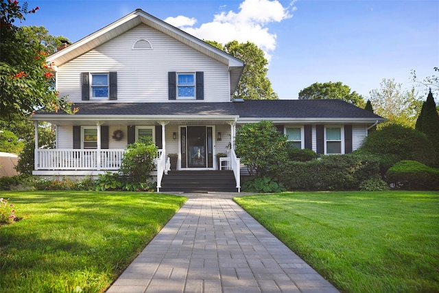 view of front of home with covered porch and a front lawn