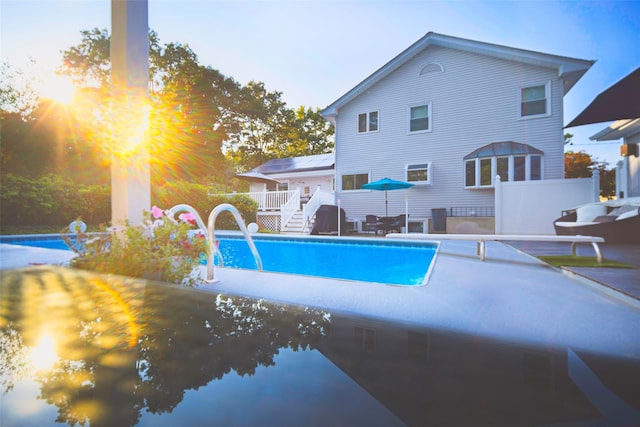 view of swimming pool with a patio area