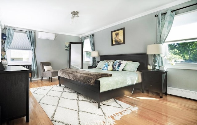 bedroom featuring crown molding, hardwood / wood-style flooring, and a baseboard radiator