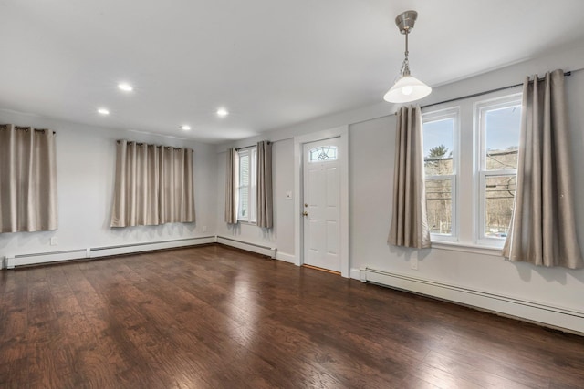 entrance foyer with dark wood-type flooring and a baseboard radiator