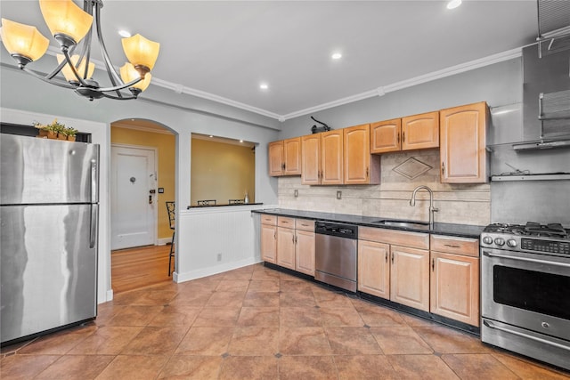 kitchen featuring appliances with stainless steel finishes, decorative backsplash, decorative light fixtures, ornamental molding, and sink