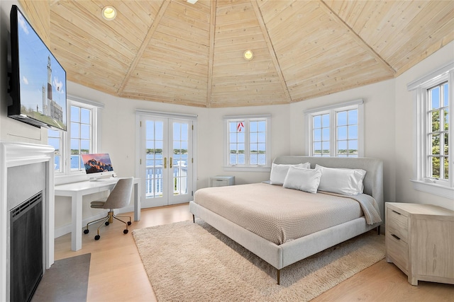 bedroom with access to exterior, french doors, light hardwood / wood-style flooring, high vaulted ceiling, and wood ceiling