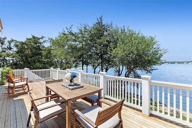 deck with a water view and a view of the beach