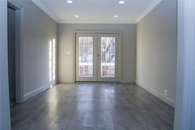 empty room with french doors, dark hardwood / wood-style flooring, and ornamental molding