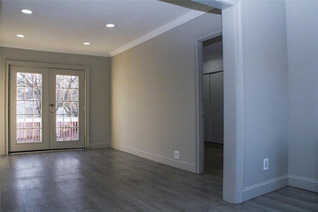 unfurnished room with dark hardwood / wood-style floors, crown molding, and french doors