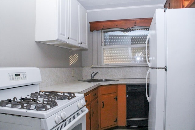 kitchen featuring decorative backsplash, sink, white appliances, and white cabinets