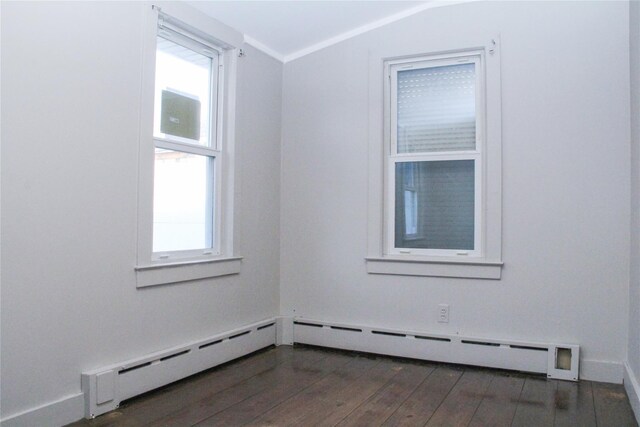 spare room featuring vaulted ceiling and dark hardwood / wood-style flooring