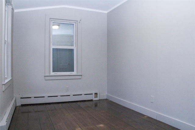 empty room featuring dark wood-type flooring, a baseboard heating unit, and ornamental molding