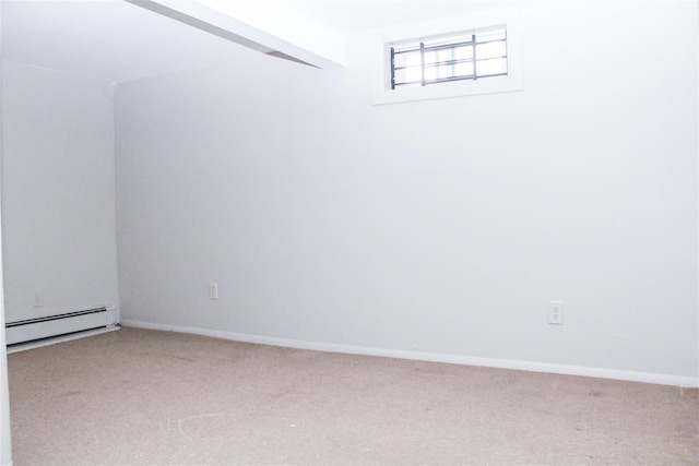 basement with carpet and baseboard heating