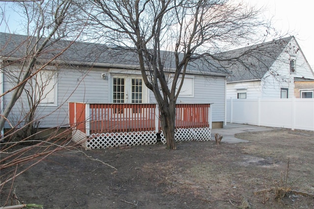 back of property with a wooden deck