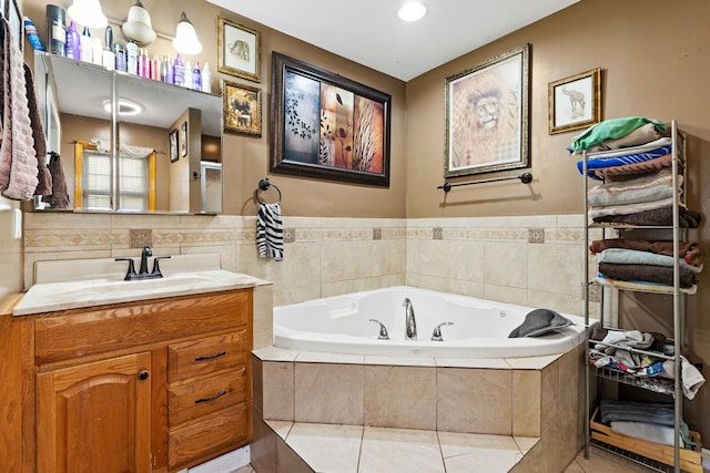 bathroom with a relaxing tiled tub and vanity