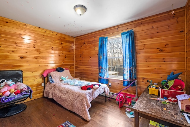 bedroom with wood finished floors and wood walls