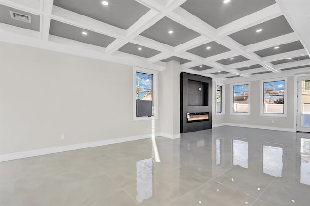 tiled spare room with a fireplace, beamed ceiling, and coffered ceiling