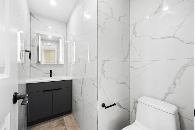 bathroom with vanity and toilet