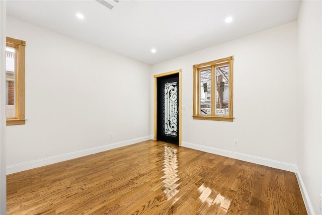 empty room featuring hardwood / wood-style flooring