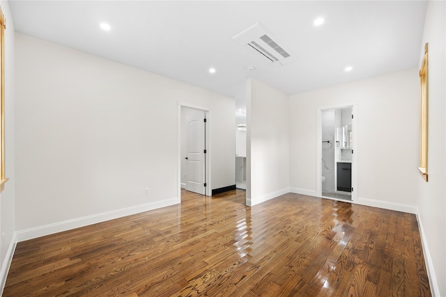 unfurnished room with hardwood / wood-style flooring