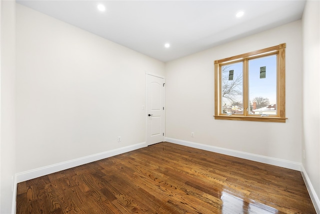 empty room featuring hardwood / wood-style flooring