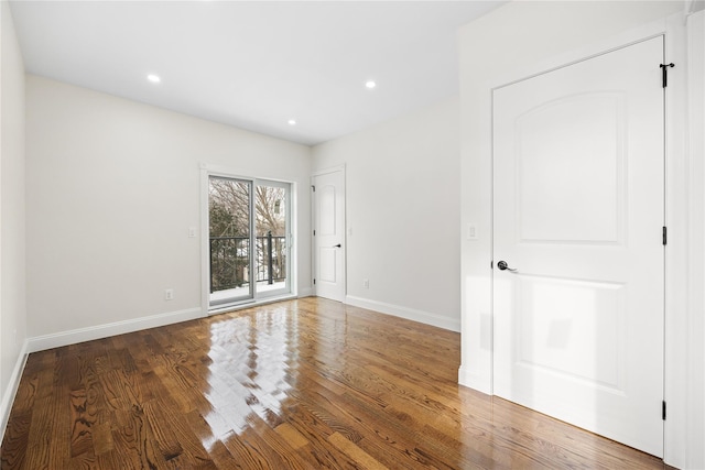 spare room featuring dark hardwood / wood-style floors