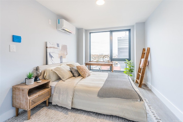 bedroom featuring a wall mounted air conditioner