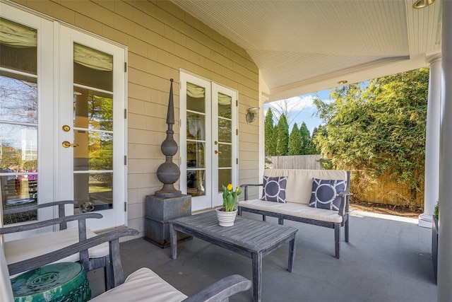 view of patio featuring fence and french doors