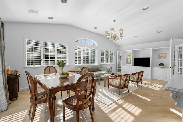 interior space featuring a chandelier and vaulted ceiling