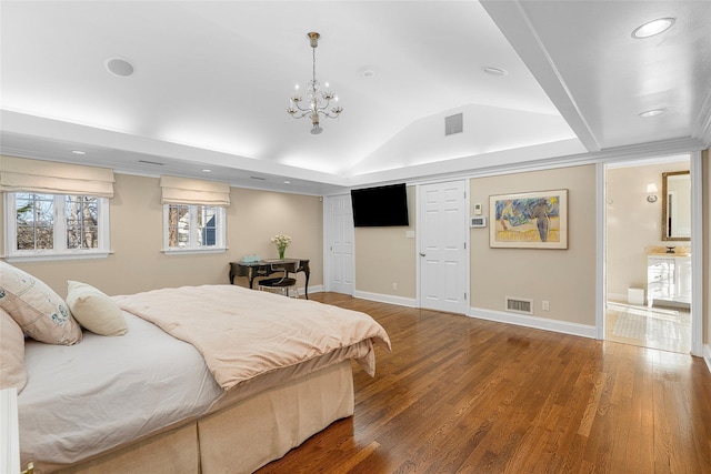 bedroom featuring lofted ceiling, visible vents, baseboards, and wood finished floors