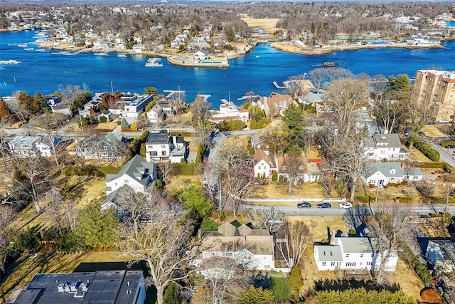 bird's eye view featuring a water view and a residential view