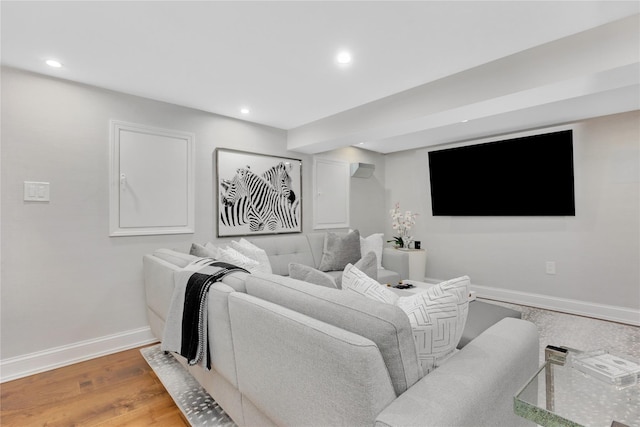 home theater room featuring hardwood / wood-style flooring