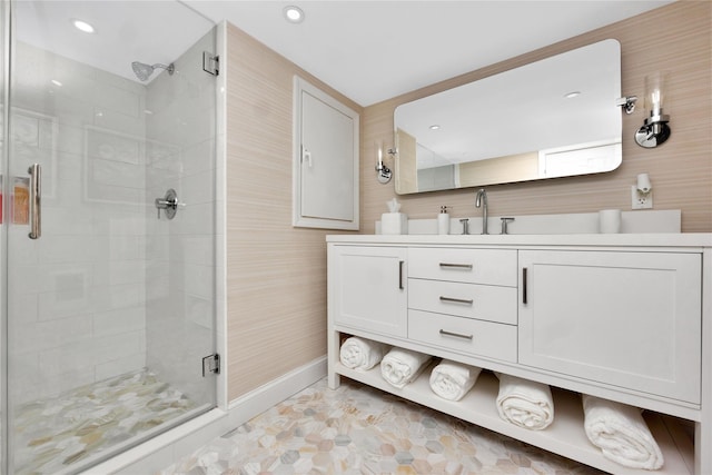 bathroom with walk in shower and vanity