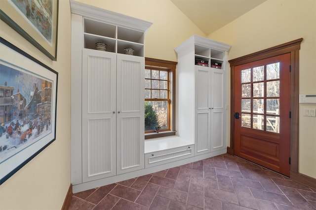 mudroom featuring lofted ceiling