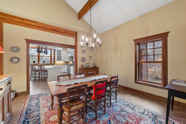 dining space with an inviting chandelier and lofted ceiling with beams