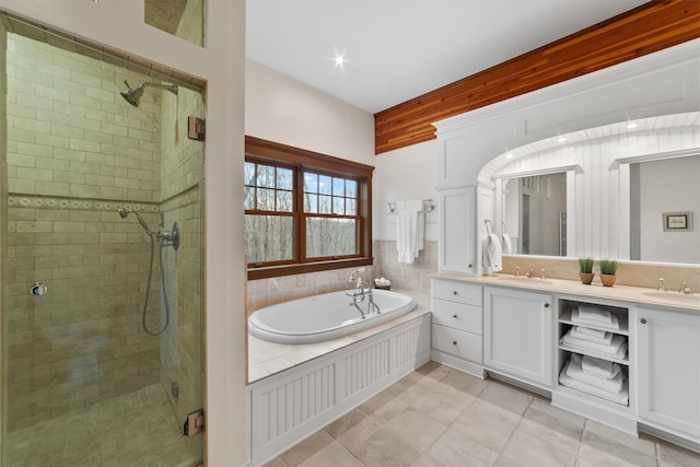 bathroom featuring vanity and plus walk in shower