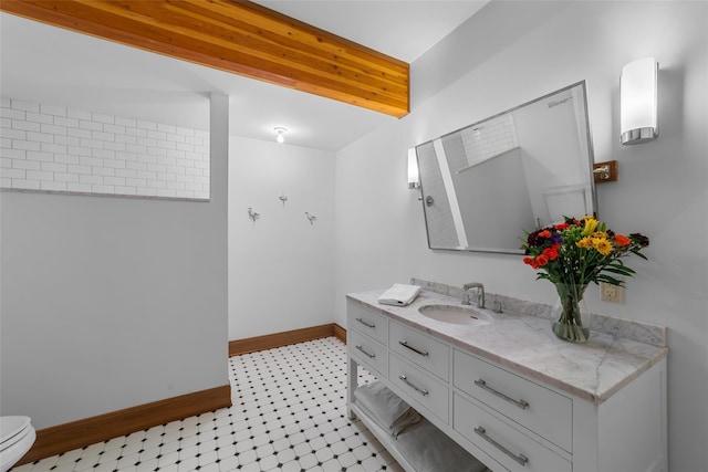 bathroom with vanity and toilet