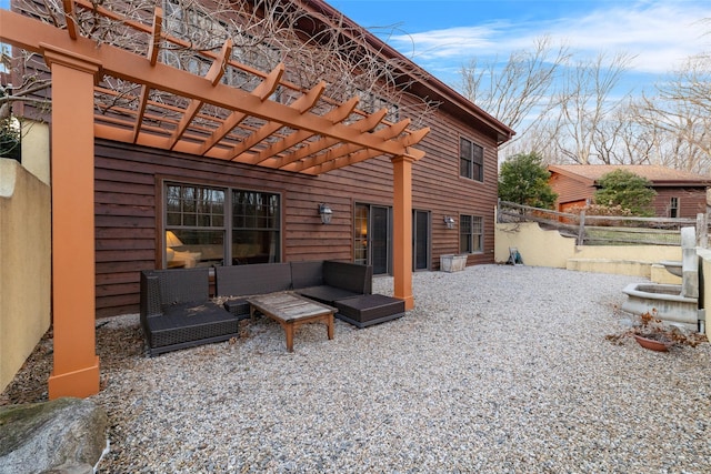 back of property featuring a pergola, outdoor lounge area, and a patio area